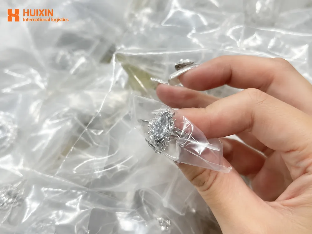 HUIXIN 3PL staff preparing jewelry orders for international shipping from China